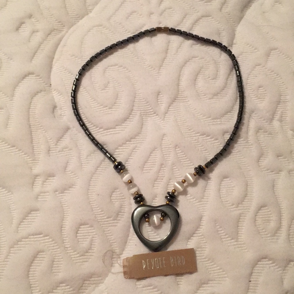 Necklace.  Opens in the back with a gold clasp